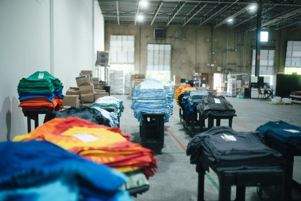 Corporate apparel order inspected and packed at From The Ashes Naples
